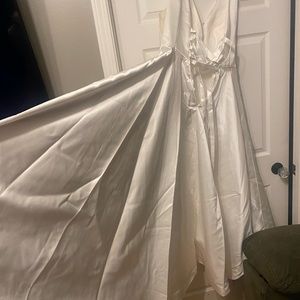 satin wedding gown w/satin lace up back. Delicate nude mesh Slight Hi-lo Lined